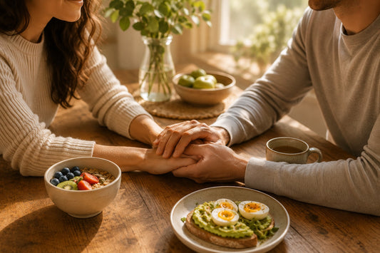 Couple together at wooden table, preparing for pregnancy